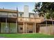 View of a backyard featuring tiered wooden decks and a small grass lawn at 1368 Poplar Se Pointe, Smyrna, GA 30082