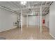 Spacious basement with wood-look floors and exposed ceiling with visible supports at 1368 Poplar Se Pointe, Smyrna, GA 30082