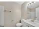 Well-lit bathroom featuring a white vanity, modern fixtures, and a framed mirror at 1368 Poplar Se Pointe, Smyrna, GA 30082
