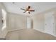 Bright bedroom with carpet flooring, neutral walls, ceiling fan, and two closets at 1368 Poplar Se Pointe, Smyrna, GA 30082