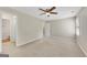Large bedroom with neutral walls, carpet, closet, and access to other rooms at 1368 Poplar Se Pointe, Smyrna, GA 30082
