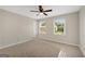 Spacious bedroom with ceiling fan, neutral walls, and natural light from the windows at 1368 Poplar Se Pointe, Smyrna, GA 30082