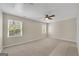 Spacious bedroom with neutral walls, carpet flooring, ceiling fan, and natural light at 1368 Poplar Se Pointe, Smyrna, GA 30082