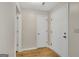 Neutral entryway with new wood flooring and white doors at 1368 Poplar Se Pointe, Smyrna, GA 30082