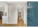 Inviting entryway with wood flooring, a view of the hallway, and neutral paint at 1368 Poplar Se Pointe, Smyrna, GA 30082
