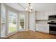 Bright kitchen with modern appliances, granite countertops, and a bay window at 1368 Poplar Se Pointe, Smyrna, GA 30082