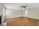 Bright living room featuring modern flooring, neutral walls, ceiling fan, and a cozy fireplace at 1368 Poplar Se Pointe, Smyrna, GA 30082