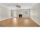 Spacious living room with a fireplace, wood floors, and neutral color palette at 1368 Poplar Se Pointe, Smyrna, GA 30082