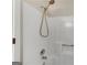 Shower with white walls, a silver shower head, and a built-in soap dish at 1368 Poplar Se Pointe, Smyrna, GA 30082