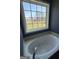 Soaking tub with jets is situated under a window providing natural light and views at 132 Scarlett Place Dr, Bowdon, GA 30108