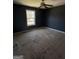 Bedroom featuring neutral walls, natural light from a single window, and ceiling fan at 132 Scarlett Place Dr, Bowdon, GA 30108