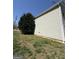 Siding view of a home with a well-maintained lawn and foliage at 132 Scarlett Place Dr, Bowdon, GA 30108