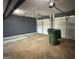Spacious two car garage with ample room for storage and overhead lighting at 132 Scarlett Place Dr, Bowdon, GA 30108