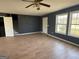 Living Room with stairs, neutral paint, hardwood floors and light-filled windows at 132 Scarlett Place Dr, Bowdon, GA 30108