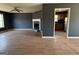 An open-concept view of the living room and adjacent kitchen at 132 Scarlett Place Dr, Bowdon, GA 30108