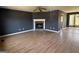 Spacious living room with hardwood floors, fireplace, and natural light at 132 Scarlett Place Dr, Bowdon, GA 30108