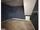 This storage room features concrete floors and a small access door at 132 Scarlett Place Dr, Bowdon, GA 30108