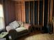 Basement featuring exposed wood frame and a couch at 1432 Eagles Nest Cir, Carrollton, GA 30116