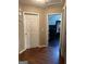 Hallway with wood floors and access to other rooms at 1432 Eagles Nest Cir, Carrollton, GA 30116