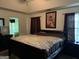 The main bedroom features vaulted ceiling, decorative picture and natural light at 1432 Eagles Nest Cir, Carrollton, GA 30116