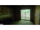 The unfinished basement offers a sliding glass door and a small desk at 1992 Kunuga Dr, Jonesboro, GA 30236