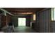 The unfinished basement includes a couch and sliding glass doors at 1992 Kunuga Dr, Jonesboro, GA 30236