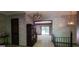 Foyer with tile flooring and stairway leading to an open living area with sliding glass doors at 1992 Kunuga Dr, Jonesboro, GA 30236