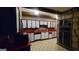 Spacious kitchen features retro white cabinets, red countertops, and black appliances at 1992 Kunuga Dr, Jonesboro, GA 30236