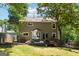 Spacious backyard with large deck and a lush lawn, perfect for outdoor entertaining at 4031 E Meadow Dr, Duluth, GA 30096