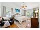 Light filled bedroom with vaulted ceilings, ceiling fan, hardwood floors and bright windows at 4031 E Meadow Dr, Duluth, GA 30096