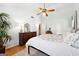 Light and bright bedroom with a ceiling fan, hardwood floors, and two dressers at 4031 E Meadow Dr, Duluth, GA 30096