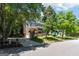 Inviting home with a long driveway and lush green lawn, showcasing the property's curb appeal and outdoor space at 4031 E Meadow Dr, Duluth, GA 30096