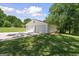 Two-car detached garage with ample space and clean white exterior, enhancing curb appeal at 204 First St, Bowdon, GA 30108