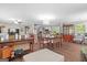 Open-concept living and dining area with a view into the kitchen, ideal for entertaining and Gathering gatherings at 204 First St, Bowdon, GA 30108