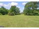 Extensive lawn, showcasing property with distant view of the home at 204 First St, Bowdon, GA 30108
