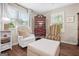 Comfortable sitting area with plush chairs, a decorative chest, and a soft ottoman, perfect for relaxation at 204 First St, Bowdon, GA 30108