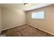Cozy bedroom with plush carpeting and a large window for natural light at 3730 Stephanie Sw Dr, Atlanta, GA 30331