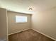 Neutral bedroom offers soft carpeting, a large window, and closet space at 3730 Stephanie Sw Dr, Atlanta, GA 30331