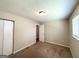This bedroom features neutral colored walls, carpeted floors, and a closet for easy storage at 3730 Stephanie Sw Dr, Atlanta, GA 30331