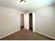 Neutral bedroom features carpeting, a large window and a closet for storage at 3730 Stephanie Sw Dr, Atlanta, GA 30331