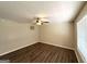 Cozy bedroom featuring neutral paint, modern ceiling fan and beautiful wood-look floors at 3730 Stephanie Sw Dr, Atlanta, GA 30331