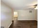 Spacious living room featuring dark wood-look floors and a modern ceiling fan at 3730 Stephanie Sw Dr, Atlanta, GA 30331
