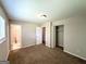 Main bedroom with carpet and ensuite bathroom featuring a closet for storage at 3730 Stephanie Sw Dr, Atlanta, GA 30331