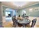 Dining room with an oval table, black chairs, and an archway leading to other rooms at 5765 Woodstone Dr, Cumming, GA 30028