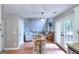 Open-concept living room features a fireplace, high ceilings, and french doors leading to a backyard at 5765 Woodstone Dr, Cumming, GA 30028