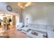Spacious living room with sectional sofa and fireplace, showcasing an open floor plan to the kitchen at 5765 Woodstone Dr, Cumming, GA 30028