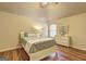 Cozy bedroom with wood floors, bed, and dresser with mirror offers a relaxing atmosphere at 2360 Braunsroth Ln, Hampton, GA 30228