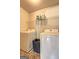 Functional laundry room with washer, dryer, and wire shelving for optimal organization at 2360 Braunsroth Ln, Hampton, GA 30228