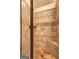 Tile shower stall features built-in seat, showerhead, and stone tile with decorative border at 2360 Braunsroth Ln, Hampton, GA 30228