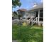 A charming backyard patio with a view of a swimming pool and well-maintained lawn creates an inviting outdoor space at 187 Pine Branch Dr, Stockbridge, GA 30281